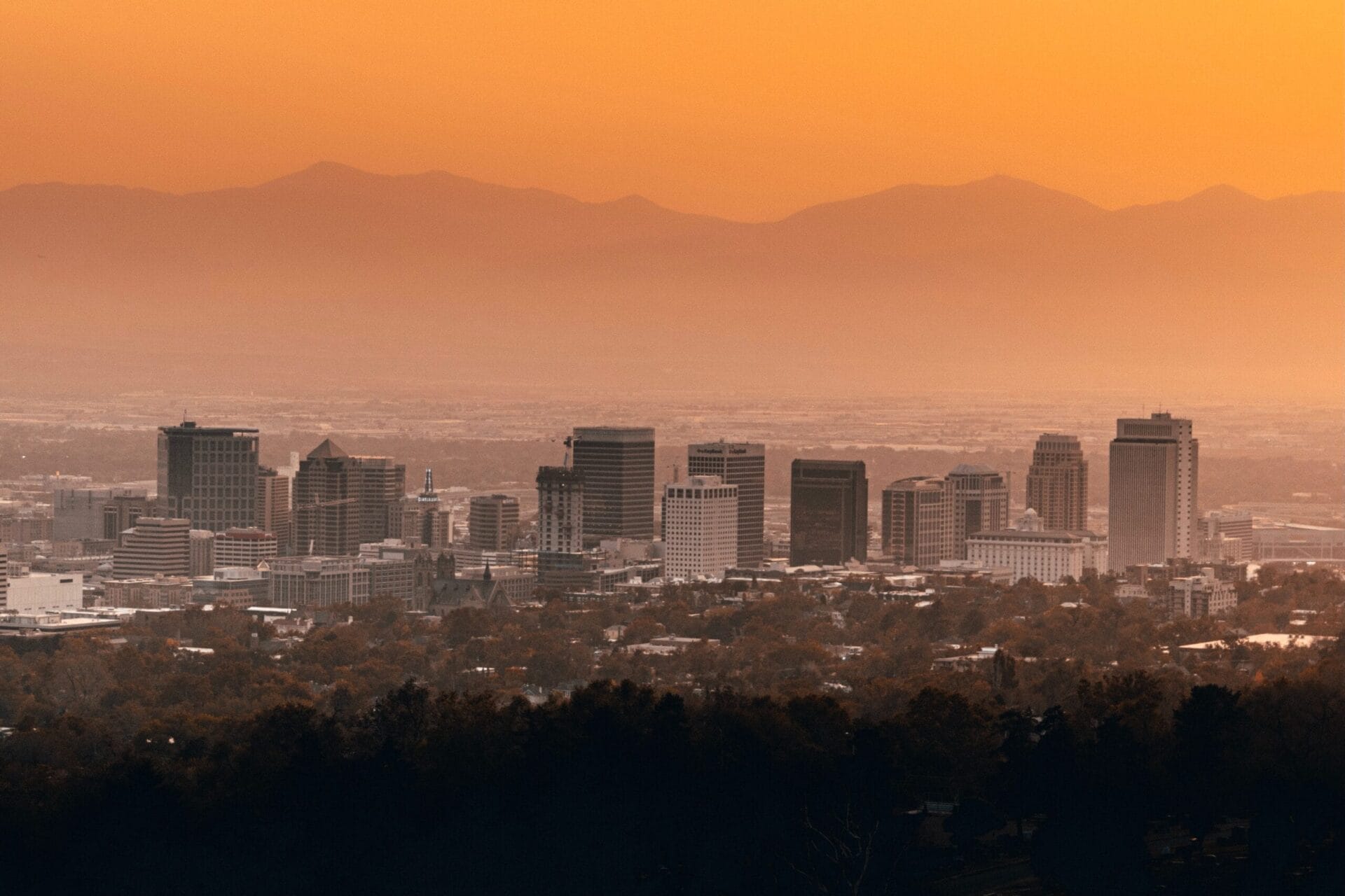 Skyline of Salt Lake City at dusk full of businesses that have equipped with surveillance cameras