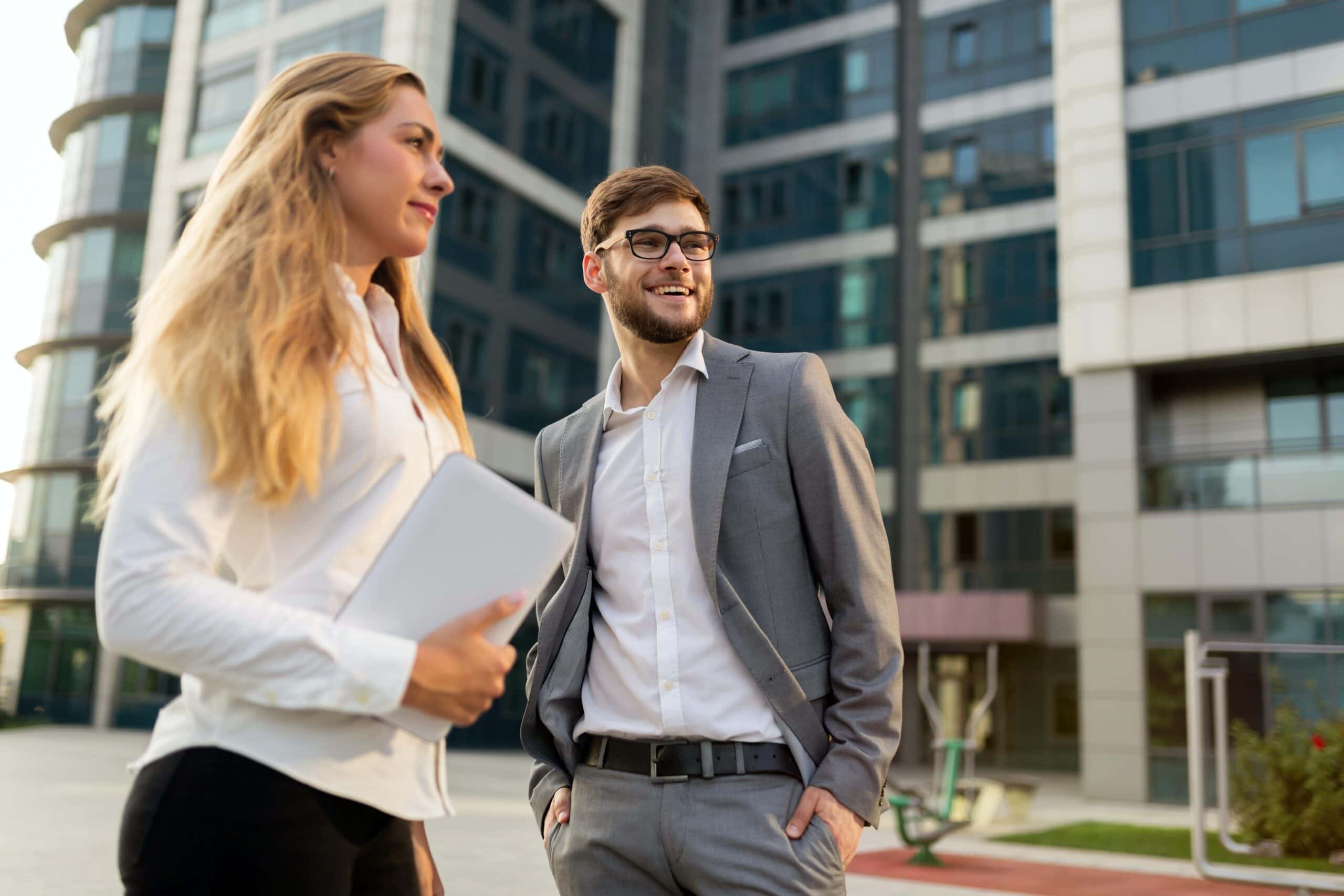 Business leaders talking outside of a building secured with 4k outdoor security cameras