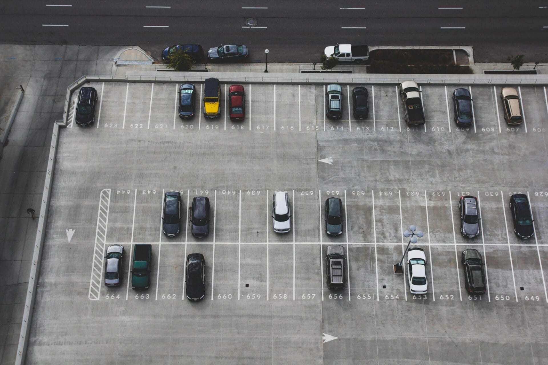 Parking lot surveilled with cameras that have video analytics license plate recognition