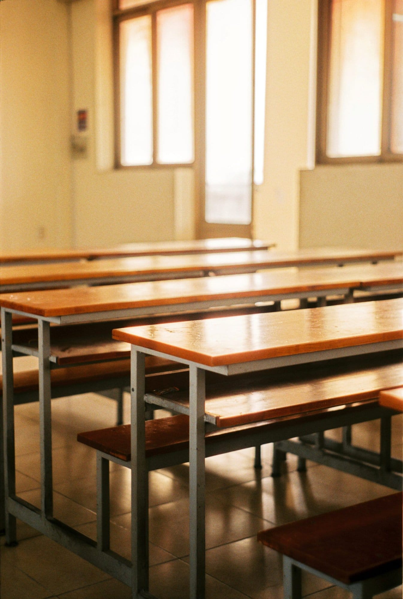 Empty lunch tables in lunchroom while lockdown system for school is activated